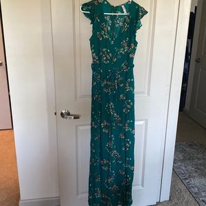 Green jumpsuit with floral details, size small